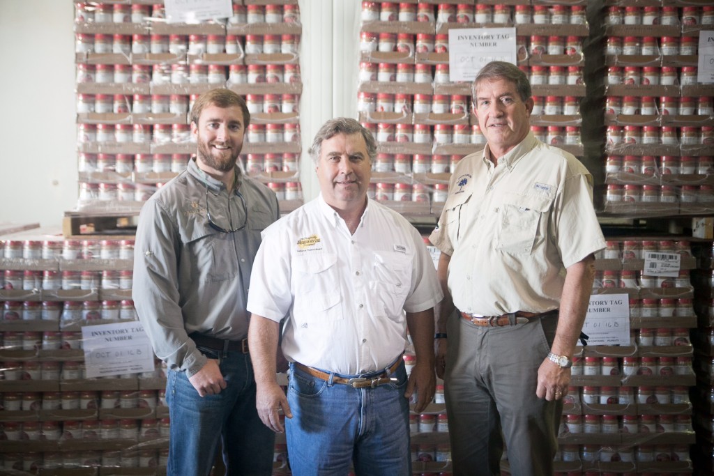 (From left to right) Brett Cogdill, Monty Rast, and Commissioner Weathers at Harvest Hope Food Bank on October 14 as the last shipment of peanut butter arrived.